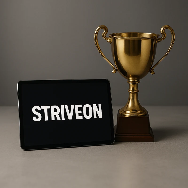 Golden trophy next to tablet displaying Striveon branding, symbolizing the winning combination of professional coaching tools and championship-level success that comes from organized, efficient team management